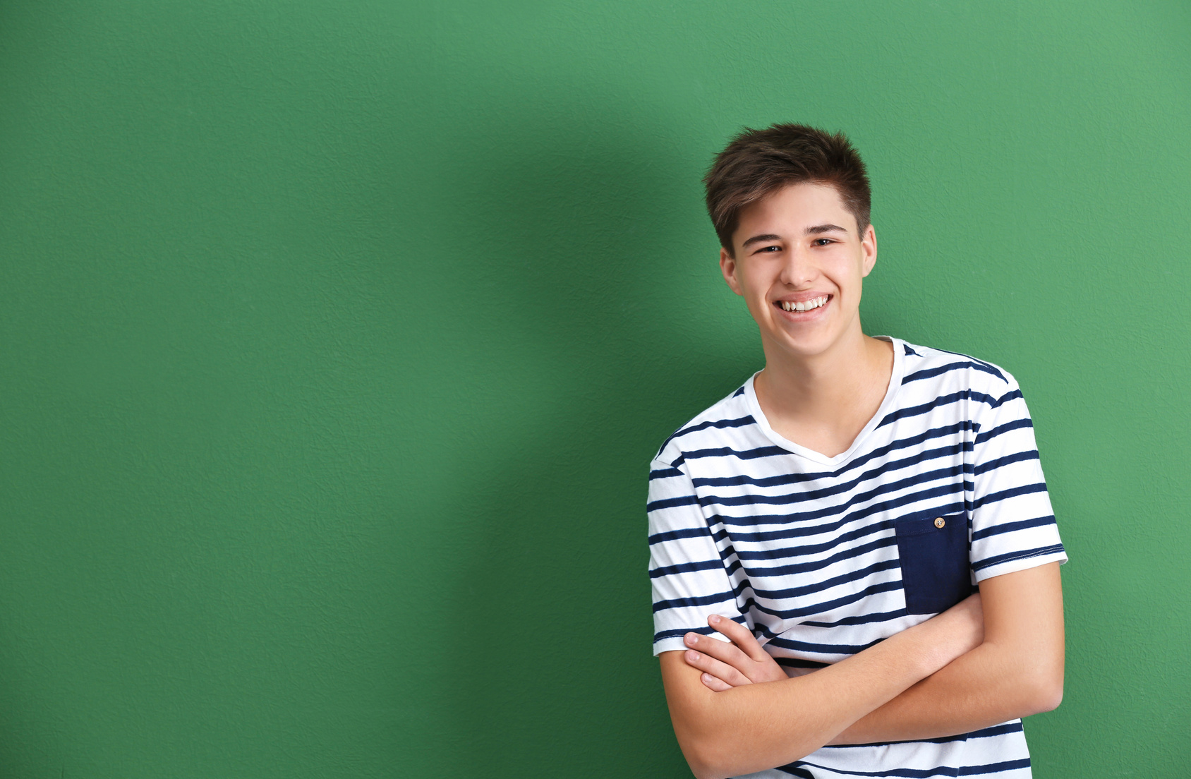 Teenage Boy on Green Background